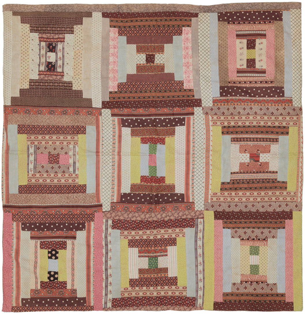 This quilt was hand-sewn in North America during the early 20th century.   It features a variation of the log cabin pattern in various hourglass shapes. The nine squares are composed of pieced-together patterned fabrics and backed with wonderful patterned fabric.  In very good condi