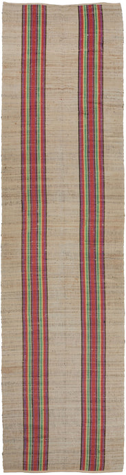 North American antique Rag Rug runner featuring two bright stripes along the length of the rug in pink, yellow, green, purple, and navy. The pop of color against the light tan field is invigorating.