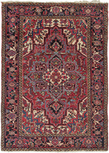 Heriz rug featuring a geometric central medallion on a dark red field with complementary light and dark blues, golden camels, and golds. An alternating palmette main border frames a prominent central medallion and four ivory ground cornices. As most Heriz rugs come in large room sizes, this is a harder-to-find size. A good rug for high-traffic areas.
