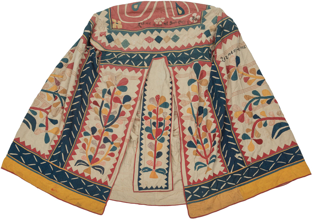This ceremonial tent was hand appliquéd in Gujarat India during the early to mid-20th century.

This rare full ceremonial tent is a wonderful example of traditional textile art once central to communal and spiritual life. Handcrafted with intricate appliqué work, the tent’s panels are alive with botanical motifs, trees of life, and auspicious symbols—including elephants, which evoke strength, wisdom, and protection. Inscribed with Gujarati script and richly embellished with dynamic geometry and floral 