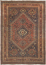 Shiraz large area rug featuring a well-balanced central design with a color palette of patinated but lively reds, blues, greens, yellow, ivory, and brown. Framed a main border that features fun and interesting zoomorphic figures that are flanked by matching minor borders of wonky botehs that each seem to have their own personality. Woven on a natural brown hand-spun wool warp and finished with pink and cream candy cane selvedge.