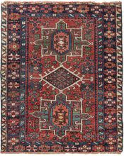 Small Karaja rug featuring a geometric triple medallion design characteristic of the type in jewel-toned blues and greens on a rich red field. The rich red field is embellished with bright, eye-catching blues. It is framed by a navy main border flanked by a crisp ivory outer border and turquoise inner border.