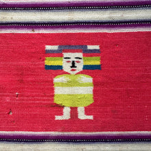 A small Zapotec weaving from Oaxaca, Mexico, likely mid–20th century, featuring a boldly stylized dancing figure at center. Rendered with outstretched arms and parted legs, the figure suggests festive movement. It wears a lime-green costume and balances a rainbow-striped headdress, evoking the colorful attire of Oaxacan fiestas and traditional dance ceremonies The figure is framed by a saturated red ground and bordered with narrow horizontal stripes in purple, white, and black. Braided wool fringe finishes 