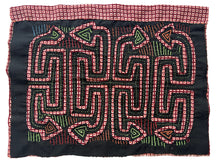 Vintage Mola cloth handmade by the Guna (previously spelled Kuna) people of the San Blas Islands.  Mola is a reverse appliqué technique, similar to the technique used in quilting but&nbsp;using multiple layers of different-colored cloth that are first sewn together before a design is created by cutting away different layers. These cloths are traditionally made in pairs to be worn on the front and back of women's blouses.  This Mola features a pattern of abstracted snakes. 