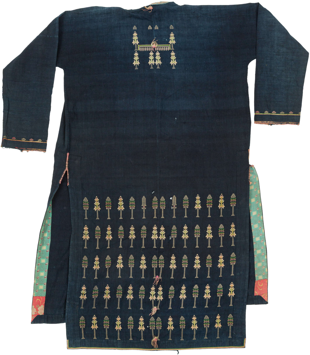 A remarkable ceremonial coat of the Tai Dam, or Black Tai, an ethnolinguistic group historically centered in northwestern Vietnam and neighboring Laos. Known as a sua hi, garments of this type were made for important ritual occasions and were particularly associated with funerary traditions and the passage of the deceased into the ancestral realm.