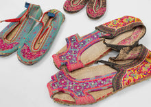 A rare set of embroidered shoes from the Xa Phang people of Dien Bien province in northern Vietnam, including examples for a man, woman, and child. Each pair is constructed with layered textile soles and richly worked uppers, decorated with vivid embroidery in pink, red, green, yellow, blue, and black.

Xa Phang women are known for their highly skilled textile work, and embroidered shoes are among the most expressive parts of traditional dress. The designs follow the community’s established visual vocabular