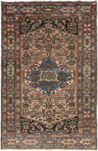 This Serab rug was woven at the end of the 20th century.   It features a central medallion of indigo, green and glowing coral atop a camel herati inspired camel field and midnight cornices. Nicely framed by a main border of floral motifs on an indigo ground and two minor borders of meandering rosettes. 