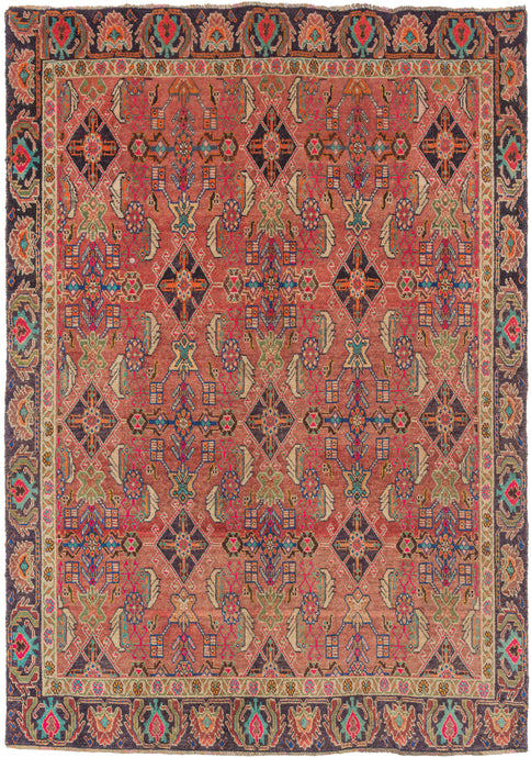 This Shiraz rug was handwoven during the end of the 20th century.   This cheerful Shiraz rug features a well-balanced variation of the Herati design in a fun and fresh palette that includes turquoise, green aubergine, yellow, orange, and both hot and dusty pink on a Nantucket red ground. The whole composition is framed by a strong border of alternating palmettes and serrated leaves.