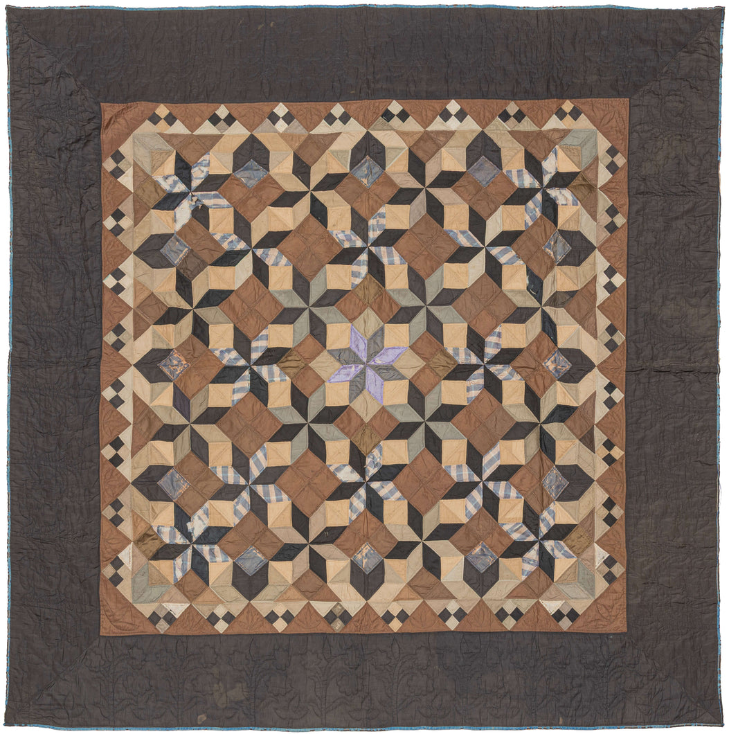 This exceptional quilt draws from the Mennonite tradition of bold geometric design. The classic LeMoyne Star, an eight-pointed star pattern introduced in America in the 19th century, is repeated and shaded to create a striking tumbling-block illusion across the entire field. The piecing demonstrates remarkable precision, with diamonds crisply aligned to build a rhythm of cubes and stars that shift depending on the viewer’s eye.