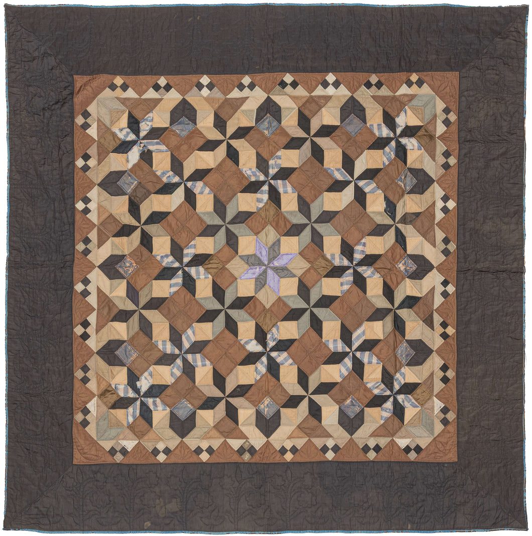This exceptional quilt draws from the Mennonite tradition of bold geometric design. The classic LeMoyne Star, an eight-pointed star pattern introduced in America in the 19th century, is repeated and shaded to create a striking tumbling-block illusion across the entire field. The piecing demonstrates remarkable precision, with diamonds crisply aligned to build a rhythm of cubes and stars that shift depending on the viewer’s eye.