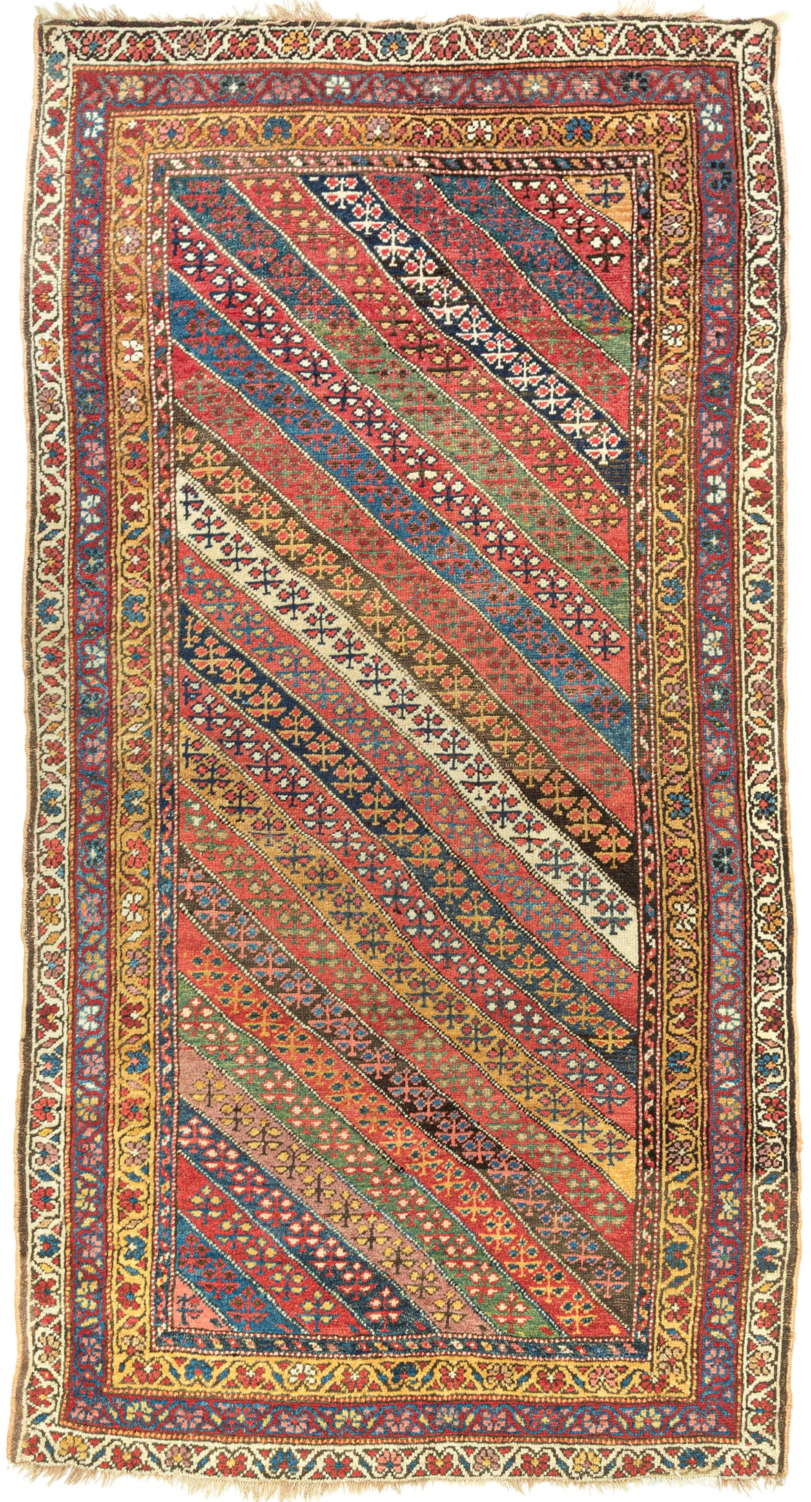 An exceptional Kurdish rug distinguished above all by its top-notch color and superb wool. The field is composed of lively diagonal bands, each carrying a different floral or geometric repeat and shifting through saturated brick red, deep indigo, grassy green, ivory, ochre, aubergine, and soft rose.