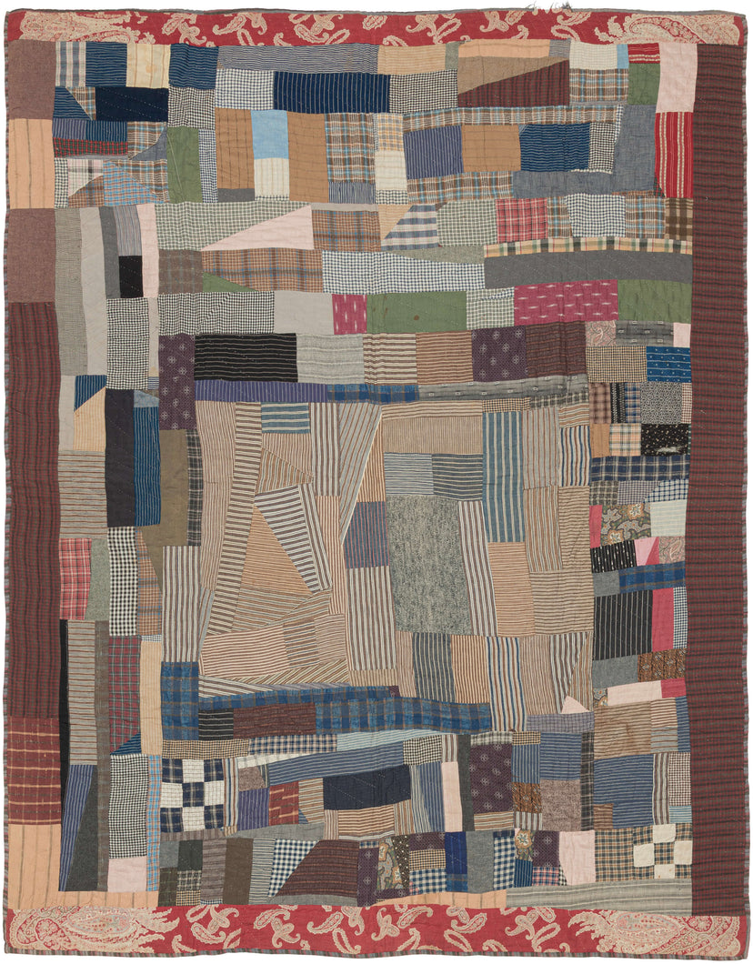 This exceptional African American workwear quilt is constructed from a rich assemblage of early 20th-century utilitarian textiles, including striped and checked shirtings, plaids, chambrays, and heavier work fabrics. Pieced from worn garments and household cloth, the composition reflects a resourceful and deeply personal approach to textile reuse, where material scarcity gave rise to striking visual complexity.