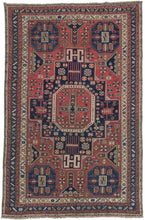 A superb late-19th-century Shirvan whose design vocabulary is more commonly encountered in Shirvan and Kuba Soumaks. The octagonal medallion-and-panel layout, the dense scattering of small rosettes, and the talismanic latch-hook devices all echo the structural geometry of flatwoven Soumak covers which is here translated into a finely knotted pile format with striking clarity. This crossover of motifs is both unusual and highly collectible, reflecting the deep interchange between pile-weaving and flatweave t