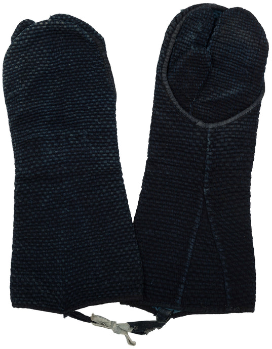 Pair of early 20th century Japanese indigo-dyed fireman’s gloves with thick woven texture and split-toe construction.