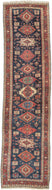 Karadagh It features a series of nested medallions that march down a rich abrashed indigo field. The medallions are rendered in blues, green, red, apricot and aubergine with geometric symbols and figures filling out the negative space. The pile is low and of lush high quality wool.