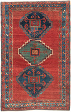 This Kazak rug was handwoven in the Southwest Caucasus during the early 20th century.

A striking example featuring three boldly drawn stepped medallions set against a vibrant, glowing red field. The palette is classic Southwest Caucasian: deep indigo, moss green, ivory, and saturated natural reds that radiate warmth and energy. The central medallion really pops and is distinguished by a lovely jewel toned blue green and enhanced by a starkly contrasting ivory outline that giving the piece strong graphic pr