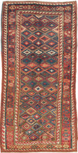 &nbsp;A striking antique Sauj Bulagh long rug, woven by Kurds. The field is densely patterned with offset rows of stepped diamond medallions in saturated tones of madder red, indigo blue, soft ivory, teal green, and warm camel against a rich brown ground.

Sauj Bulagh rugs are particularly admired for their bold color and powerful village drawing. This example has an especially lively allover composition, with each stepped medallion carrying a small central cross form, creating a strong sense of movement ac