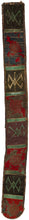 A striking Yoruba beaded sash from Nigeria, densely worked with glass beads in bold red, blue, green, yellow, white, and black. The long narrow form is divided into geometric panels with diagonal bands, diamond motifs, and a dramatic raised mask-like face at one end.