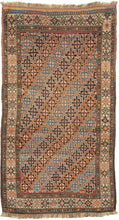 An antique Quchan Kurdish rug woven with an allover field of small stepped geometric medallions in soft salmon, indigo blue, turquoise, ivory, and warm brown. The closely arranged motifs create a lively, mosaic-like surface, framed by an ivory floral border and narrow geometric guard borders.

Quchan rugs were woven by Kurdish communities in the Khorasan region and are admired for their strong tribal drawing, durable construction, and expressive use of color. This example is especially appealing for its com
