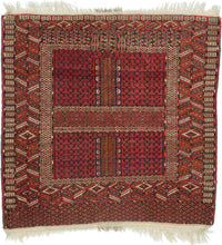 A richly patterned Tekke Turkmen ensi, traditionally woven as a door hanging for the entrance of a yurt. The classic four-part composition gives the piece its architectural quality, with paneled fields, vertical divisions, and layered borders that echo the idea of a threshold.