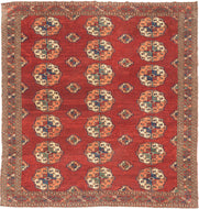 This Tekke main rug was handwoven during the first quarter of the 20th century in Turkmenistan.

The field features a grid rounded main guls in apricot, indigo, turquoise and ivory on vibrant red ground. The space between the grid is filled with rows of cruciform shaped secondary guls. In a rare square format that allows for very luxurious and open spacing of the guls.