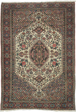 This finely woven Bakhtiari rug is distinguished by its elegant ivory medallion field framed by richly ornamented millefleurs corner spandrels. Graceful vinery and abundant gul farang (“foreign flower”) cabbage roses fill the composition, creating a refined balance between geometric structure and naturalistic floral ornament.