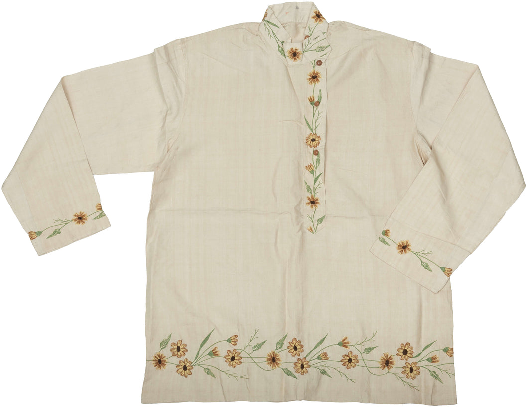 This elegant vintage Indian Kurta is crafted from soft, handwoven cotton in a natural cream tone, delicately embroidered with wildflower motifs in warm golden, green, and earthy brown tones. The floral embellishment flows organically along the hem, cuffs, and front placket, offering a refined yet joyful expression of traditional artistry.