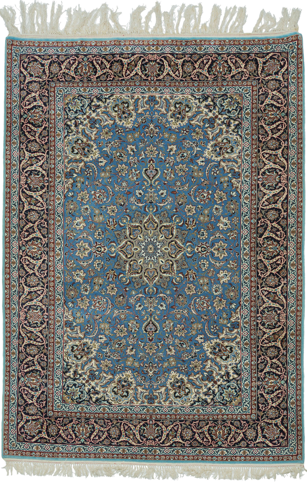 This elegant vintage Nain rug showcases the refined floral artistry that has made these weavings among the most admired of workshop carpet traditions. A luminous sky-blue field is centered by an intricate ivory and camel medallion, surrounded by a graceful lattice of scrolling arabesques, delicate blossoms, and finely drawn palmettes. The richly contrasting midnight navy border frames the composition beautifully, adding depth and sophistication.