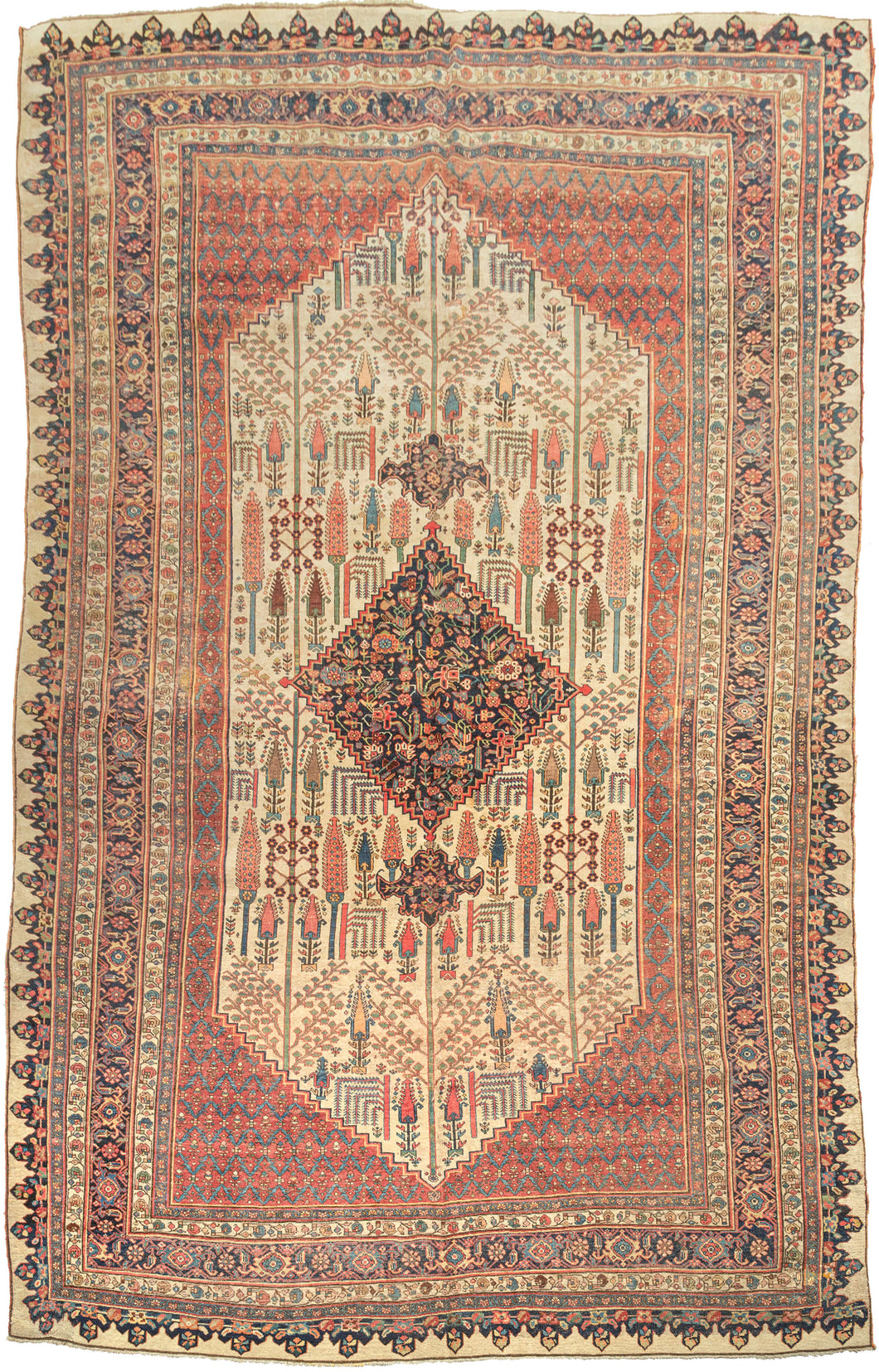 This grand scale antique Bidjar carpet features the evocative Bid Majnun design a poetic and symbolic layout named for the weeping branches of the trees and reminiscent of the legendary figure Majnun in Persian literature. The rare ivory ground provides a luminous backdrop for a striking garden composition, filled with stylized willows, cypresses, and flowering shrubs rendered in rich natural dyes.