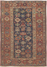 A richly patterned Soumak from the northeastern Caucasus, woven in the 19th century with an unusually varied assortment of boldly drawn floral and geometric forms.

The deep indigo field is densely populated with stylized palmettes, rosettes, blossoms and angular vegetal devices, individually rendered in saturated shades of madder red, blue, green, ivory and golden yellow. The floral vocabulary closely recalls the celebrated Kuba “blossom” rugs, whose fields are similarly animated by large, colorful palmett