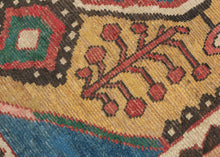 This vibrant Gabbeh was woven by the Qashqai during the 2nd quarter of the 20th century

The design centers on bold concentric diamond medallions floating on a warm saffron field. The medallions are flanked by playful flowering shrubs and framed by a charming rosette border. The palette is exceptional: saturated indigo, terracotta, sky blue, and emerald green, all rendered in luminous natural dyes.