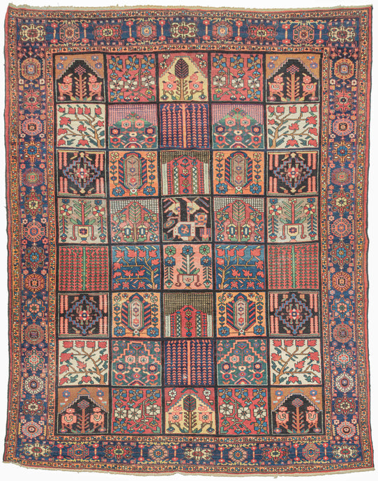 A dazzling mosaic of color and pattern, this Bakhtiari garden carpet embodies one of the most celebrated designs in Bakhtiari weaving. The field is laid out in a grid of rectangular compartments, each filled with distinctive vignettes of stylized floral sprays, trees of life, geometric abstractions, and architectural motifs. The diversity within each panel creates a captivating patchwork, at once orderly and exuberant. Lively tones of coral, madder red, indigo, sky blue, ivory, and soft green animate the de