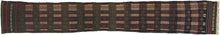 A handsome Baluch trapping with a long, graphic format and a deeply saturated palette of aubergine, forest green, madder, ivory, and dark brown. The design is built from a rhythmic checkerboard of small geometric devices, with serrated ivory bands running vertically through the field and a narrow decorative side border adding balance and movement.