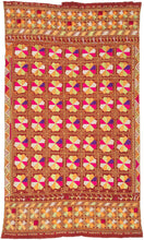 Phulkari is a traditional folk embroidery style from the Punjab region, which spans both India and Pakistan. It is composed of colorful silken thread atop rough cotton cloth.&nbsp;This Phulkari was embroidered in silk floss on multiple red cotton strips and features a striking composition of kaleidoscopic floral medallions arranged in a dense grid. Finished with skirt borders of interlocking motifs, including zoomorphic bird-like figures on one end.&nbsp; Highly contrasting tones of fuchsia, saffron, pistac