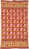 Phulkari is a traditional folk embroidery style from the Punjab region, which spans both India and Pakistan. It is composed of colorful silken thread atop rough cotton cloth.&nbsp;This Phulkari was embroidered in silk floss on multiple red cotton strips and features a striking composition of kaleidoscopic floral medallions arranged in a dense grid. Finished with skirt borders of interlocking motifs, including zoomorphic bird-like figures on one end.&nbsp; Highly contrasting tones of fuchsia, saffron, pistac