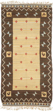 This kilim was handwoven during the middle of the 20th Century in Sweden.

It features red cruciform motifs against a variegated yellow ground with bits of ivory and brown blended in. Framed by a strong variegated brown border with abstracted birds and turquoise "bowties" that are surrounded by thin zig zag and finished with a skirt border on top and bottom