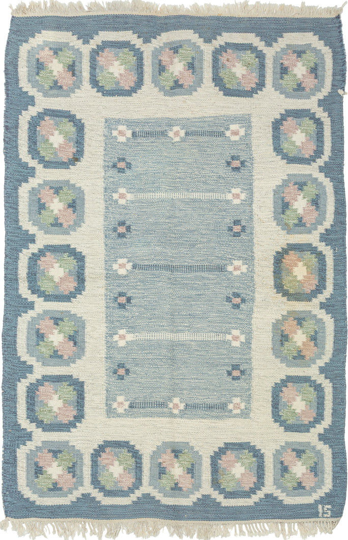 A refined mid-century Swedish flat weave by celebrated designer Ingegerd Silow, signed with her 