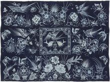A striking Miao batik wall hanging or coverlet on a deep indigo ground, densely animated with birds, butterflies, fish, flowers, and curling vines in white wax resist. The imagery draws on a rich symbolic vocabulary associated with the natural world, fertility, abundance, renewal, and continuity.