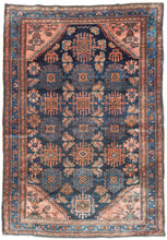 This Hamadan rug presents a classic village composition with a direct, confident hand. An allover design unfolds across a navy ground, featuring a fresh palette of earthy reds and rust tones balanced by indigo, soft ivory, and subtle accents of blue and green. Coral cornices brighten the field, while a fluid blue border frames the composition, flowing around the perimeter like a pool of water.