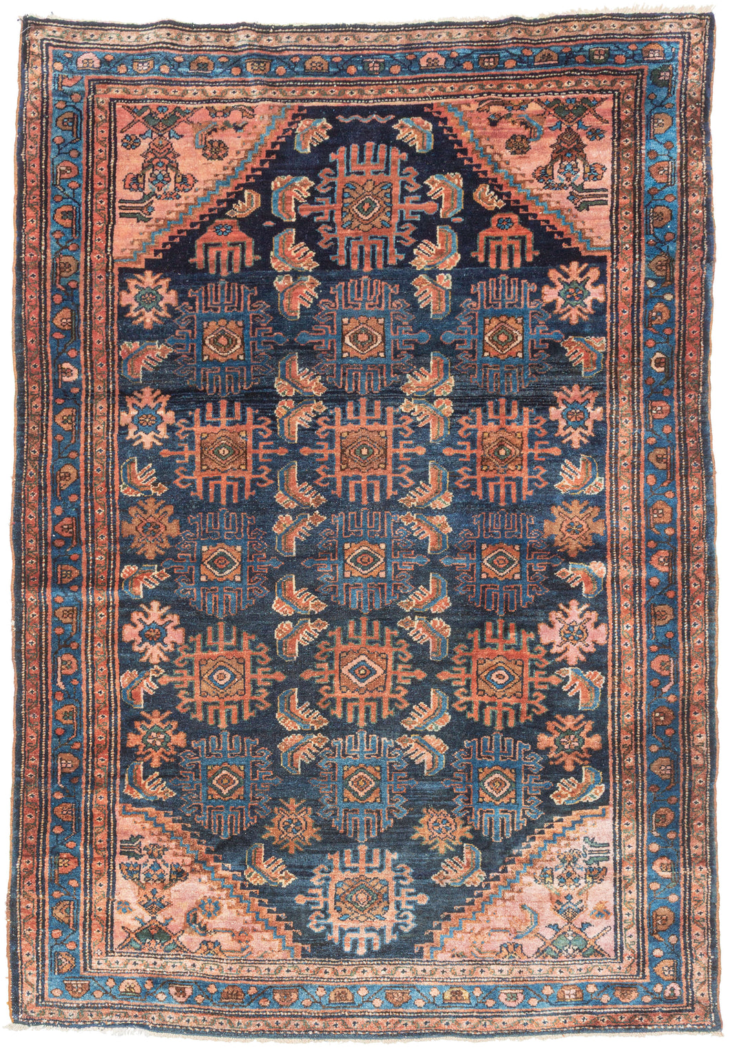 This Hamadan rug presents a classic village composition with a direct, confident hand. An allover design unfolds across a navy ground, featuring a fresh palette of earthy reds and rust tones balanced by indigo, soft ivory, and subtle accents of blue and green. Coral cornices brighten the field, while a fluid blue border frames the composition, flowing around the perimeter like a pool of water.