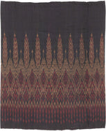 This elegant silk pha sin or traditional tube skirt was handmade northeast Thailand during the middle of the 20th century.

It is a masterful example of mudmee (ikat) weaving from the Isaan region.&nbsp;The central field (phuen sinh) displays alternating vertical bands of nested diamonds and stylized rice ear or flame motifs that are elongated and tapered into arrow forms that symbolize fertility, protection, and spiritual aspiration in regional Lao-Tai iconography.

The top band (hua sinh) offers a rhythm 