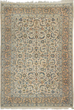 This&nbsp;vintage Kashan rug showcases the timeless refinement of one of the most celebrated weaving traditions. Woven on a luminous ivory field with an allover lattice of scrolling arabesques, palmettes, and delicate floral sprays, creating a graceful sense of movement and balance. A soft palette of ivory, powder blue, celadon, camel, and warm apricot lends the piece an airy sophistication while emphasizing its crisp drawing and fine craftsmanship.