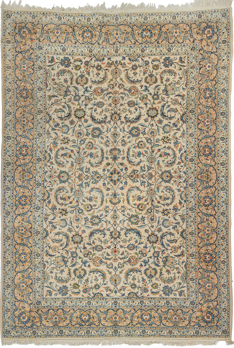 This&nbsp;vintage Kashan rug showcases the timeless refinement of one of the most celebrated weaving traditions. Woven on a luminous ivory field with an allover lattice of scrolling arabesques, palmettes, and delicate floral sprays, creating a graceful sense of movement and balance. A soft palette of ivory, powder blue, celadon, camel, and warm apricot lends the piece an airy sophistication while emphasizing its crisp drawing and fine craftsmanship.