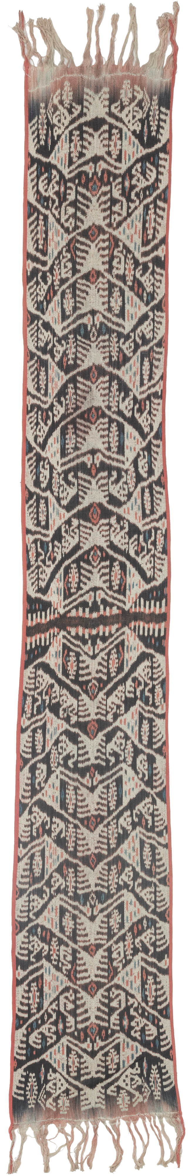 A striking West Timor cotton ikat featuring rhythmic ancestral and vegetal motifs arranged in a vertical progression. Deep brown-black and soft ivory form the primary contrast, accented by subtle coral and indigo details that animate the surface.

The repeating shield-like forms and branching motifs reflect Timorese ceremonial weaving traditions, executed in warp ikat with characteristic feathered edges. Finished with traditional fringe and side bindings.

One of a matching pair with TX518, ideal for symmet