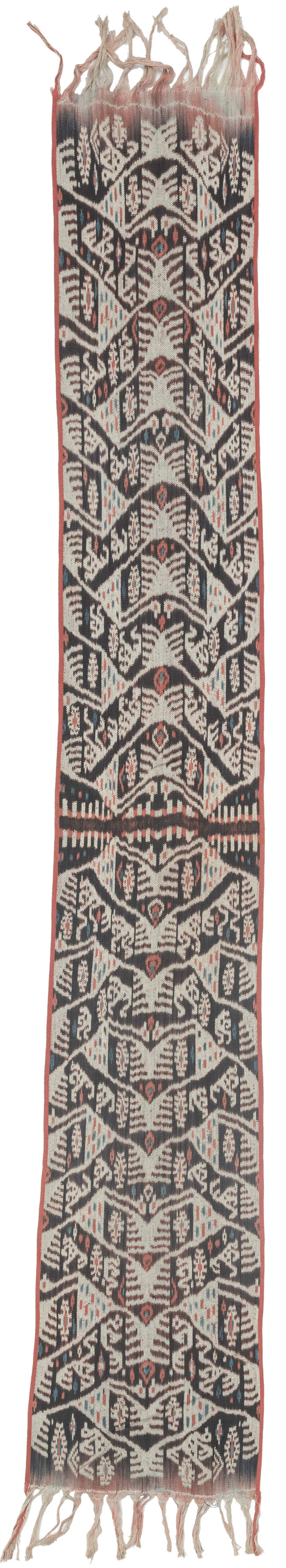 

A striking West Timor cotton ikat featuring rhythmic ancestral and vegetal motifs arranged in a vertical progression. Deep brown-black and soft ivory form the primary contrast, accented by subtle coral and indigo details that animate the surface.

The repeating abstracted figural forms and branching motifs reflect Timorese ceremonial weaving traditions, executed in warp ikat with characteristic feathered edges. Finished with traditional fringe and side bindings.