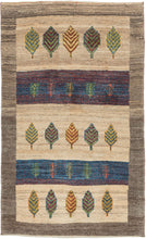 Contemporary It features alternating stripes of variegated undyed wool with stripes of red and blue. Each stripe contains simple representations of trees and vegatation in various colorful tones. Framed by a thick and wavy undyed wool border. The pile is densely woven, making this a plush rug.