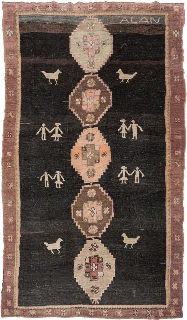 This expressive Kars rug from Eastern Anatolia brings together traditional village weaving with playful, almost naïve figural motifs. Set against a dark brown-black ground, the central row of soft pastel medallions is flanked by charming depictions of birds and pairs of human figures holding hands, giving the piece a narrative and whimsical character.