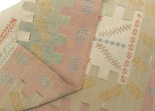 Silk Syrian It features a lovely directional motif reminiscent of a tree of life with rows of "S"s on top and bottom. Various interlocking blocks both emphasize and celebrate the interlocking tapestry technique utilized. A soft and delicate palette of faded blush, warm gold and muted celadon give it an ethereal almost dreamlike quality perfect matching it's materially.
