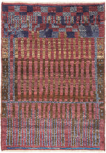 This striking composition exemplifies the bold modernism that can found in Morocco’s weaving tradition. Geometric and architectural in sensibility, the design features a structured grid of vertical and horizontal bands in shades of rose, olive, and indigo creating a rhythmic, almost musical interplay of line and color. The subtle irregularities of handwoven technique lend the piece warmth and movement, softening its graphic precision.