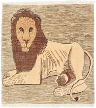 A charming and expressive Gabbeh rug featuring a noble lion reclining against a variegated undyed wool ground. The weaver has rendered the lion with remarkable character, its attentive gaze, full rust-colored mane, and softly contoured form exude both strength and warmth. The natural variation of the background wool creates subtle tonal movement, beautifully complementing the handspun texture and earthy palette.

Gabbeh rugs are known for their spontaneity and narrative imagery. This example celebrates the 